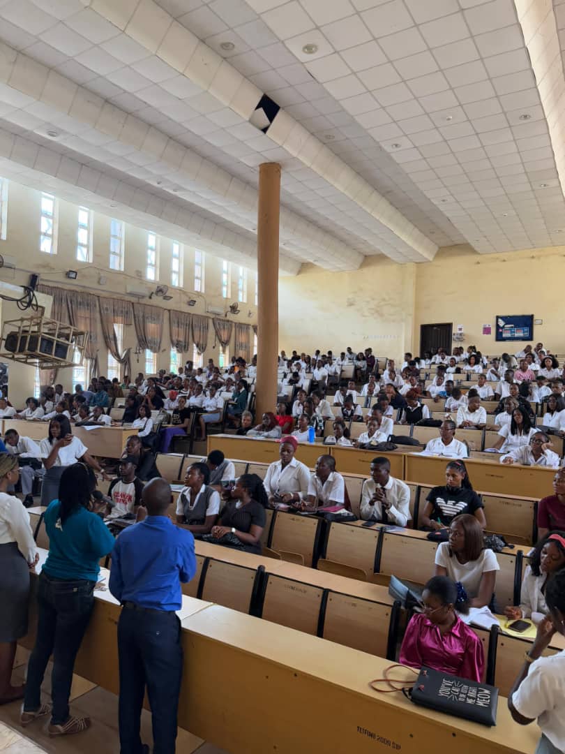 student club members in a hall